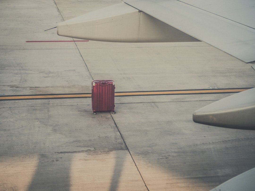 Suitcase wheels and telescoping handle checked before travel