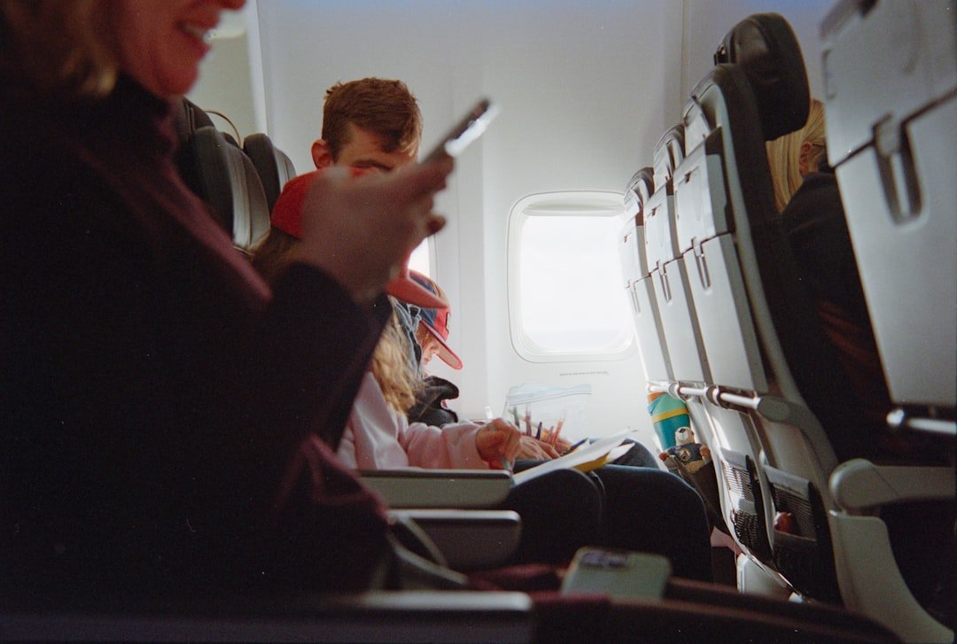 Compact long-flight comfort kit prepared for an airplane seat