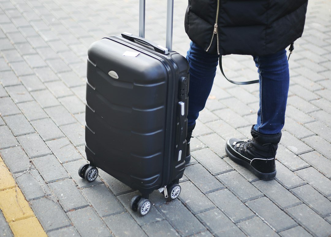 a person pulling a suitcase